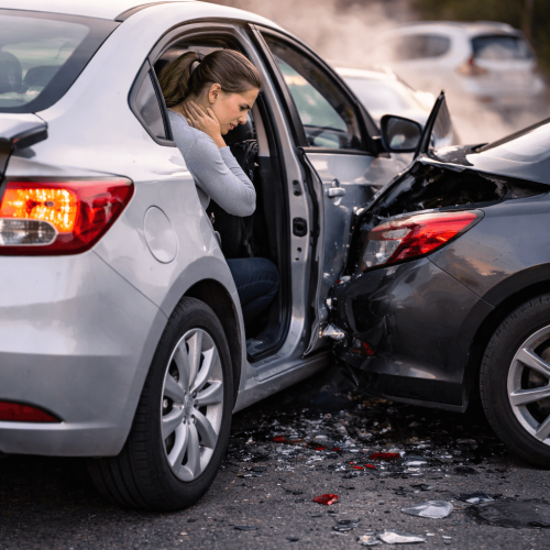 Rear-End Motor Vehicle Accident Injury in Langley ICBC Injury treatment in langley. Driver experiencing neck pain after a rear-end motor vehicle accident collision, illustrating common whiplash injury symptoms
